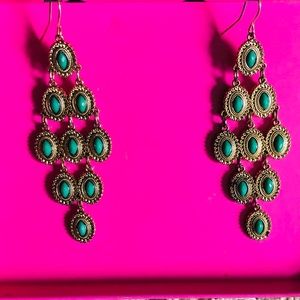 Gold chandelier earrings with mint green stones